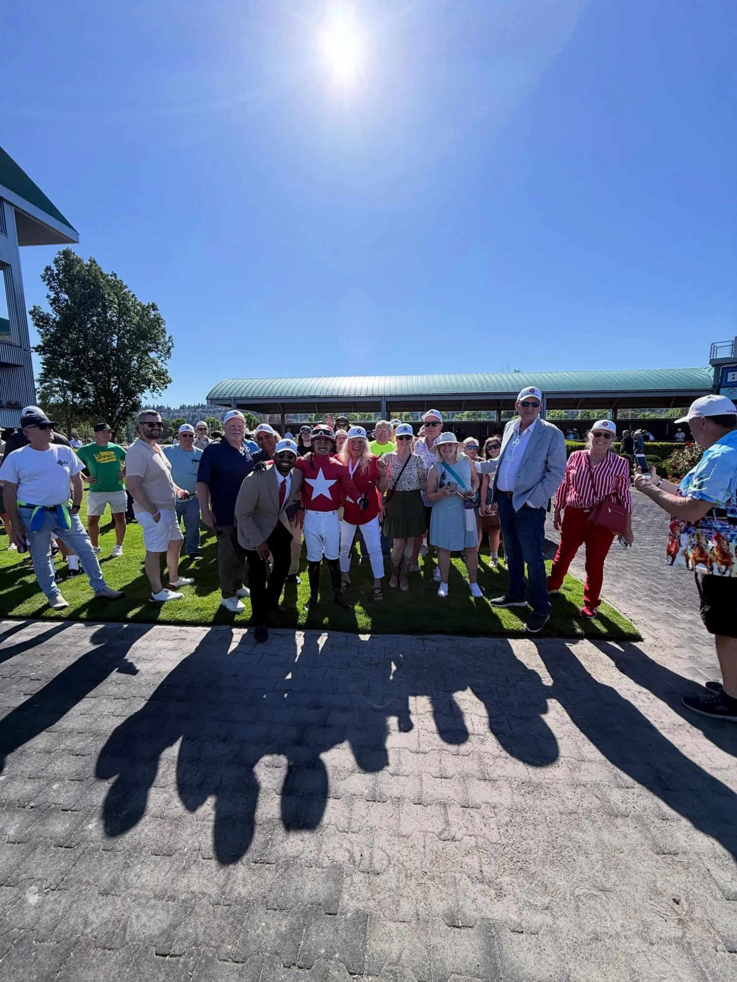 Owners with the jockey in CTF silks trackside
