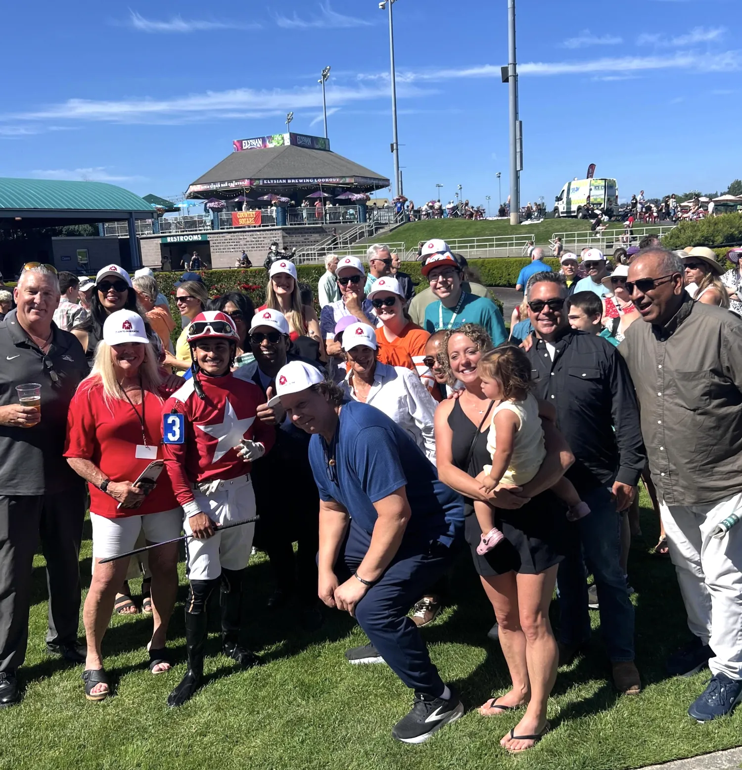 Claim To Fame Racing owners gathered with the jockey in CTF silks after a win at Emerald Downs